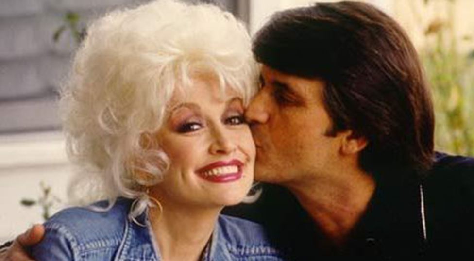Dolly Parton smiling with her husband, Carl Dean