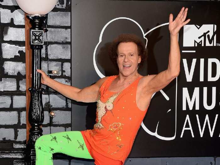 Richard Simmons looking happy in fitness club