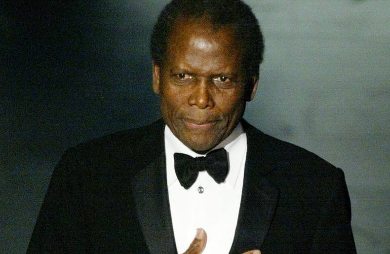 Sidney Poitier in black suit and white shirt